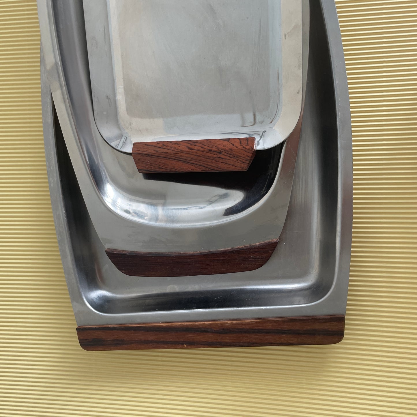 Stainless steel plate with wooden handle