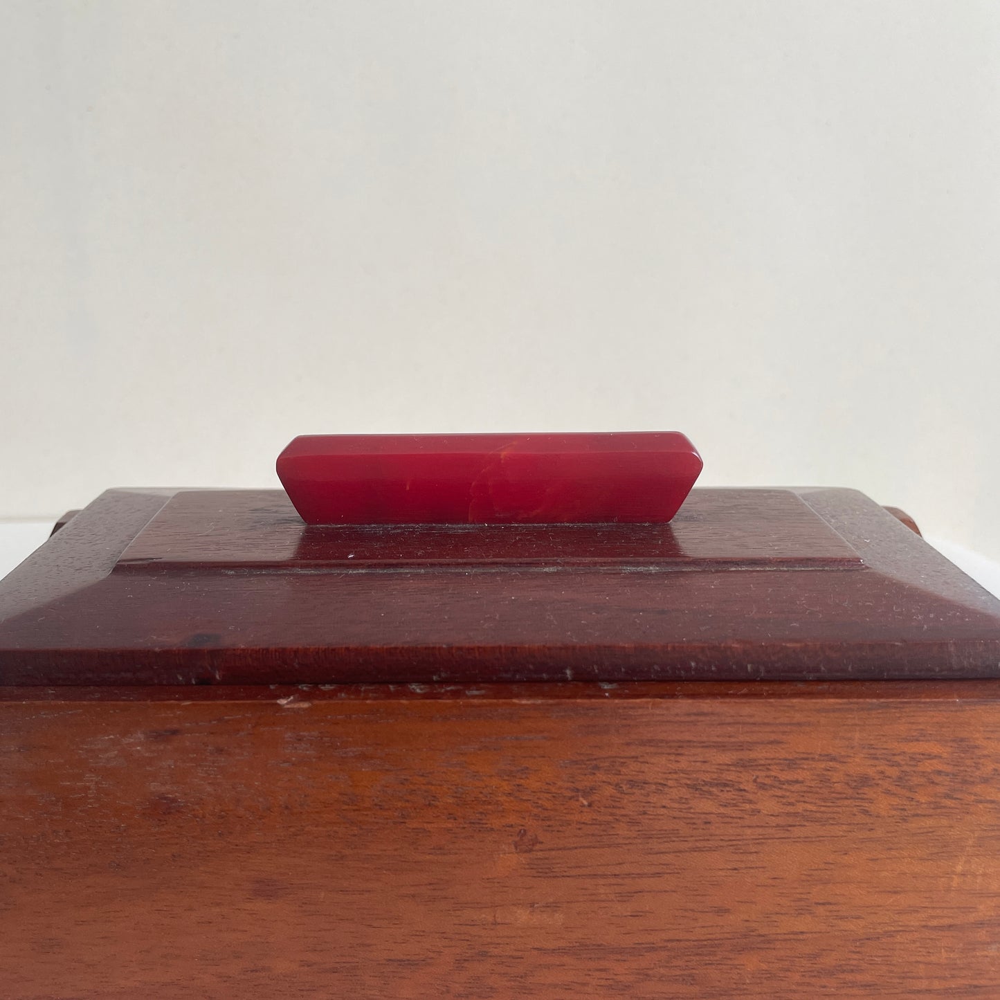 Art deco wooden box with red marbled Bakelite handle